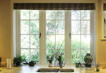 unusual 1920's design with smaller casements either side in uniform panes